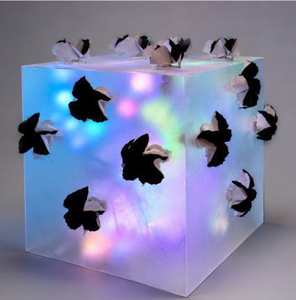 Finished Sound of the Bloom acrylic cube with origami flowers and multicolored illumination